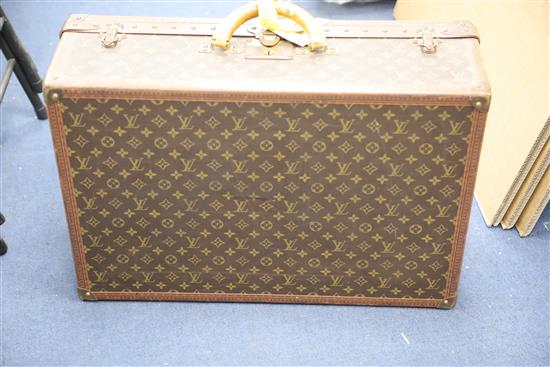 A Louis Vuitton suitcase, 25.75 x 17.5 x 8.5in.